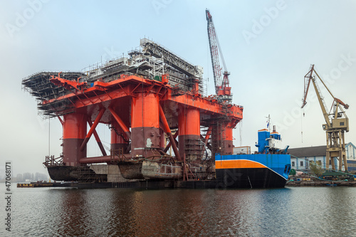 12 000 ton Oil Rig was pulled from the water on a special barge photo