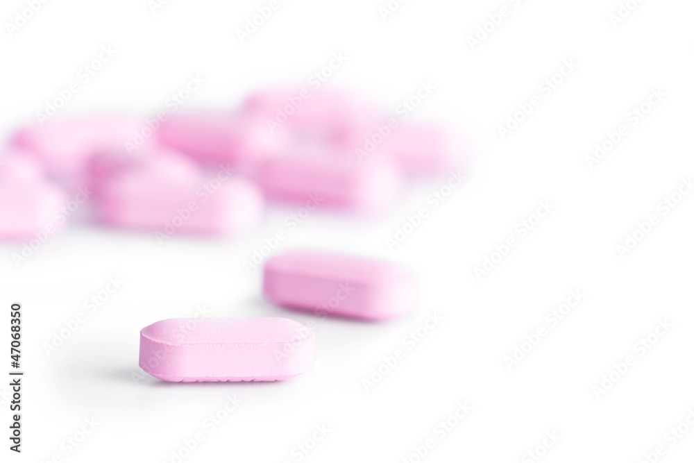 Pink pills isolated on white Pink pills isolated on white