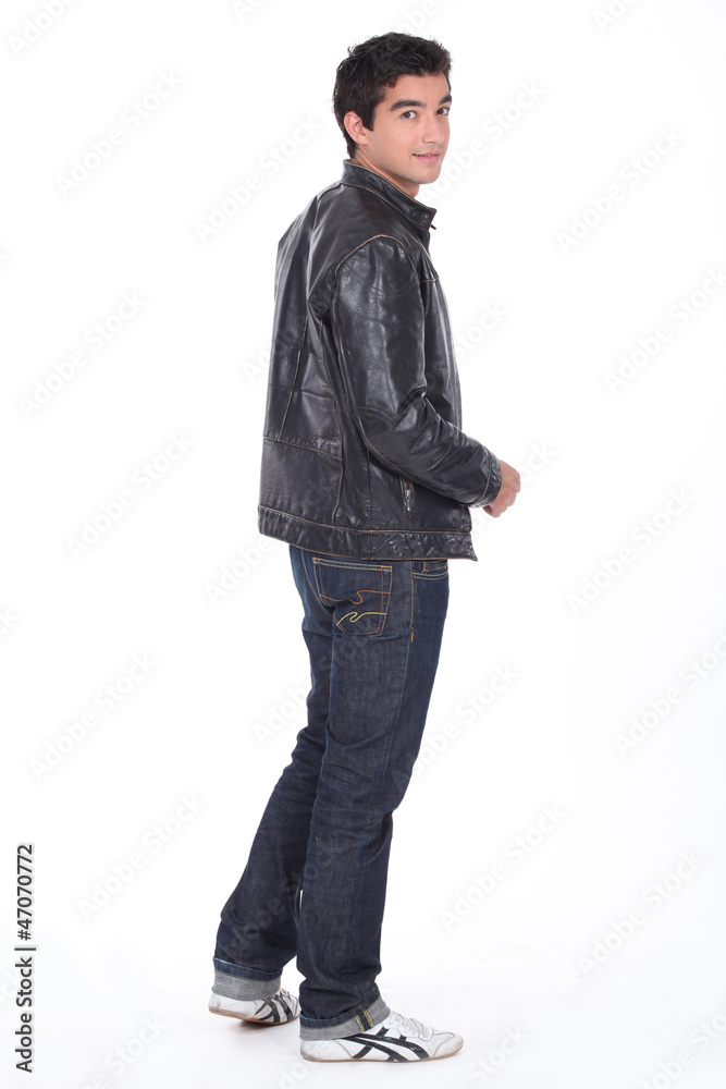 Naklejka premium Young man in a leather jacket