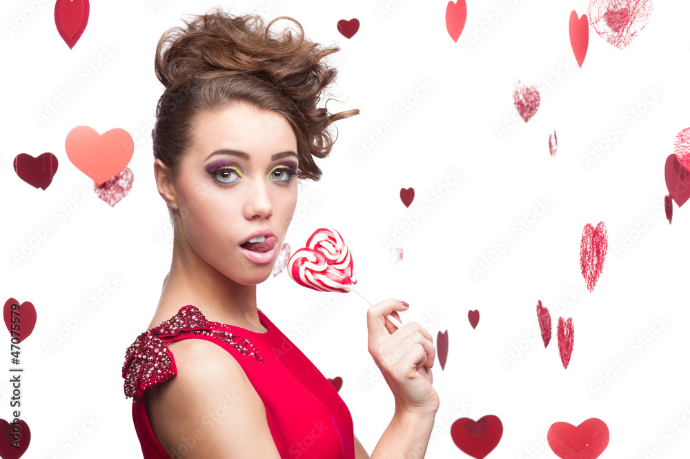 brunette woman holding lollipop brunette woman holding lollipop