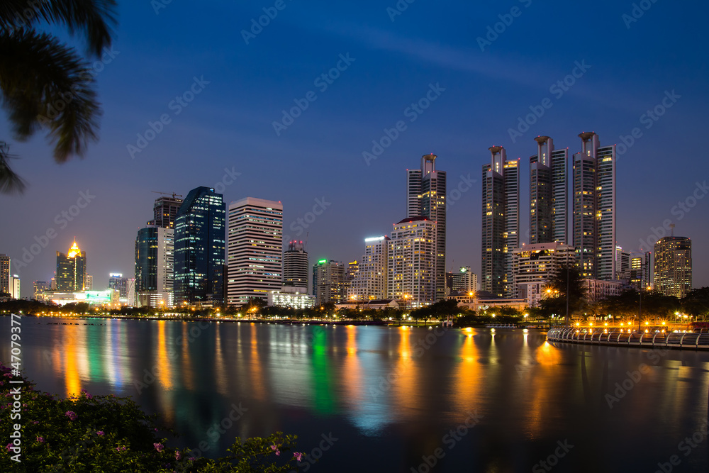 Bangkok city downtown at night with reflection of skyline, Bangk