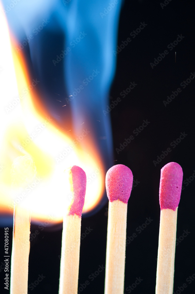 Match bursting to flame, vertical shot, macro Match bursting to flame, vertical shot, macro