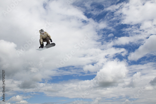 flying snowboarder on mountains