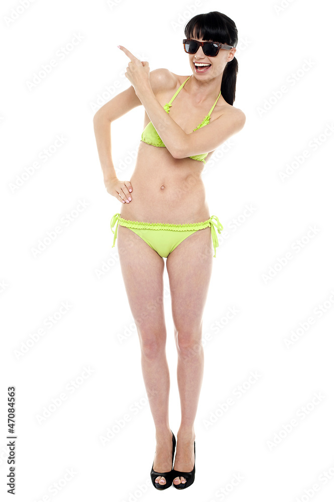 Attractive woman in green bikini being expressive Attractive woman in green bikini being expressive