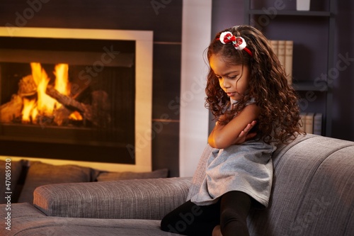Photography Sulky little girl in living room
