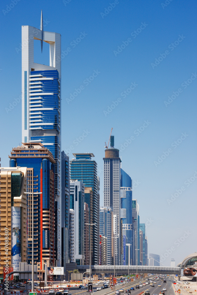Obraz premium Sheikh Zayed Road is graced with skyscrapers for miles