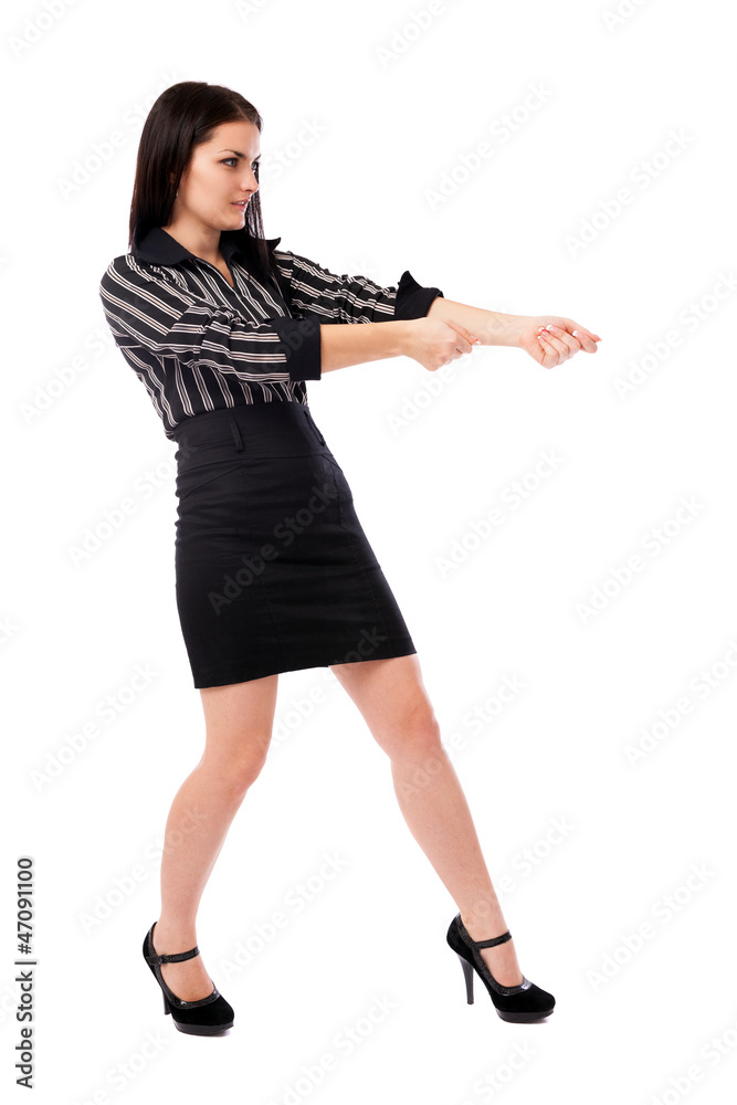 Young businesswoman pulling an imaginary rope Young businesswoman pulling an imaginary rope