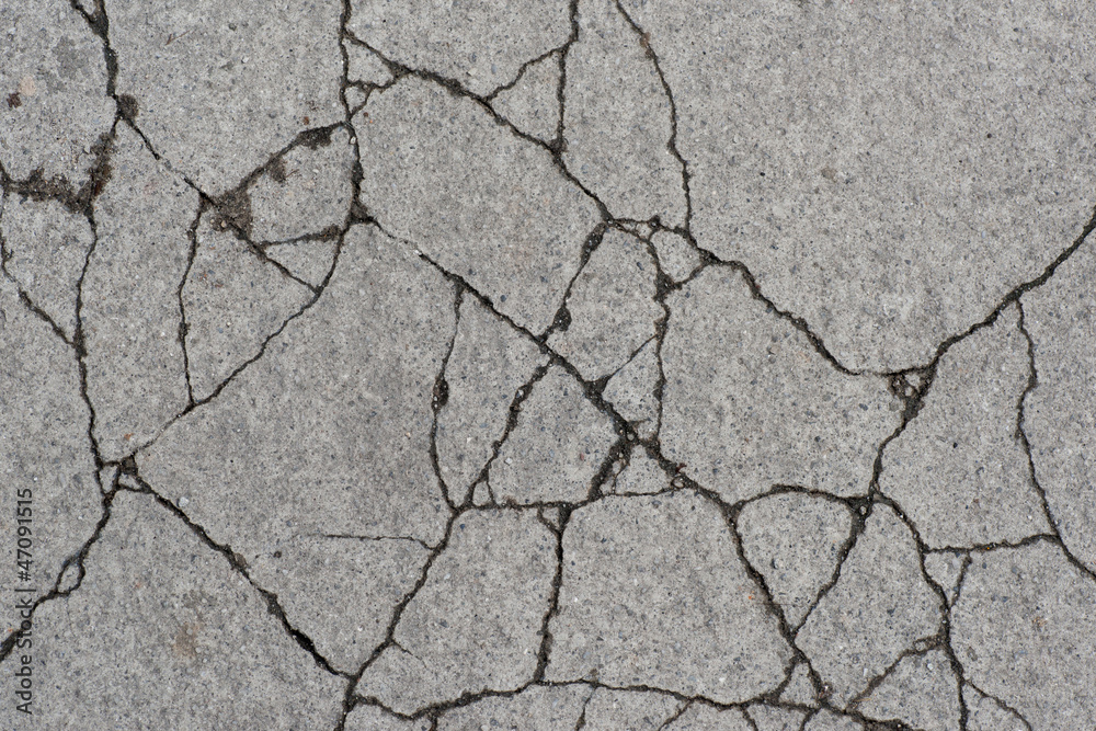 Obraz premium Grunge textured concrete sidewalk with cracks