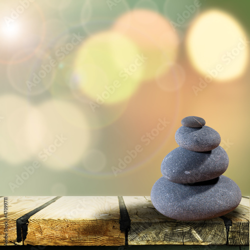 Abstract asian backgrounds with pebble over wooden desk