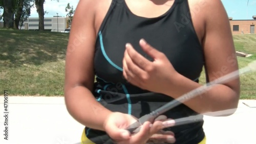 Girl Twirling Baton in Sun