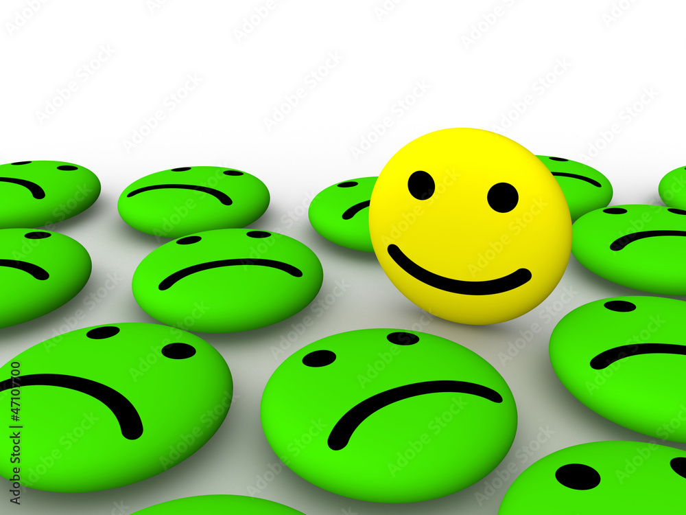 Happy smiley face among sad smileys Happy smiley face among sad smileys