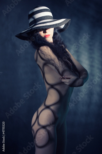 fashion portrait of naked lady with hat