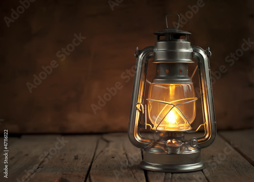 Oil Lamp at Night on a Wooden Surface