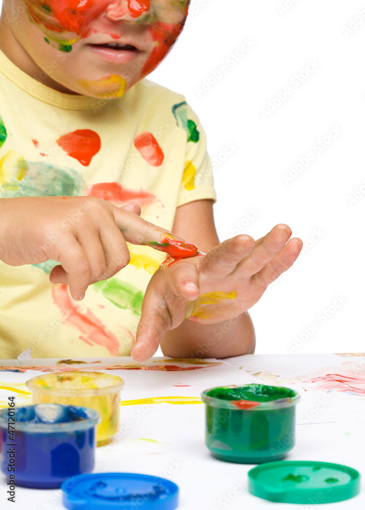 Portrait of a cute girl playing with paints Portrait of a cute girl playing with paints