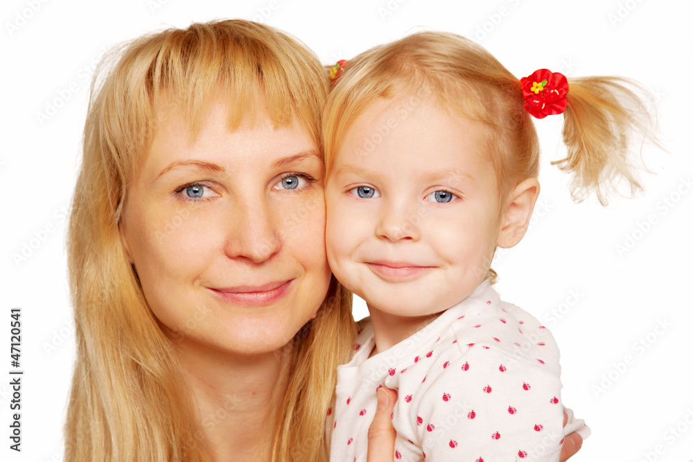 Happy blond mother and daughter faces close-up. Happy blond mother and daughter faces close-up.