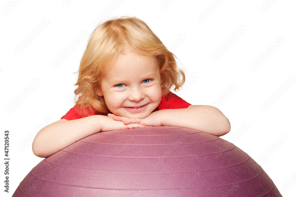 baby with blue eyes smiling and playing with fitness ball. baby with blue eyes smiling and playing with fitness ball.