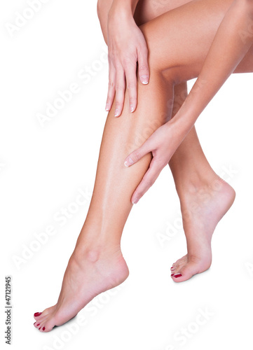 Woman caressing her silky smooth legs