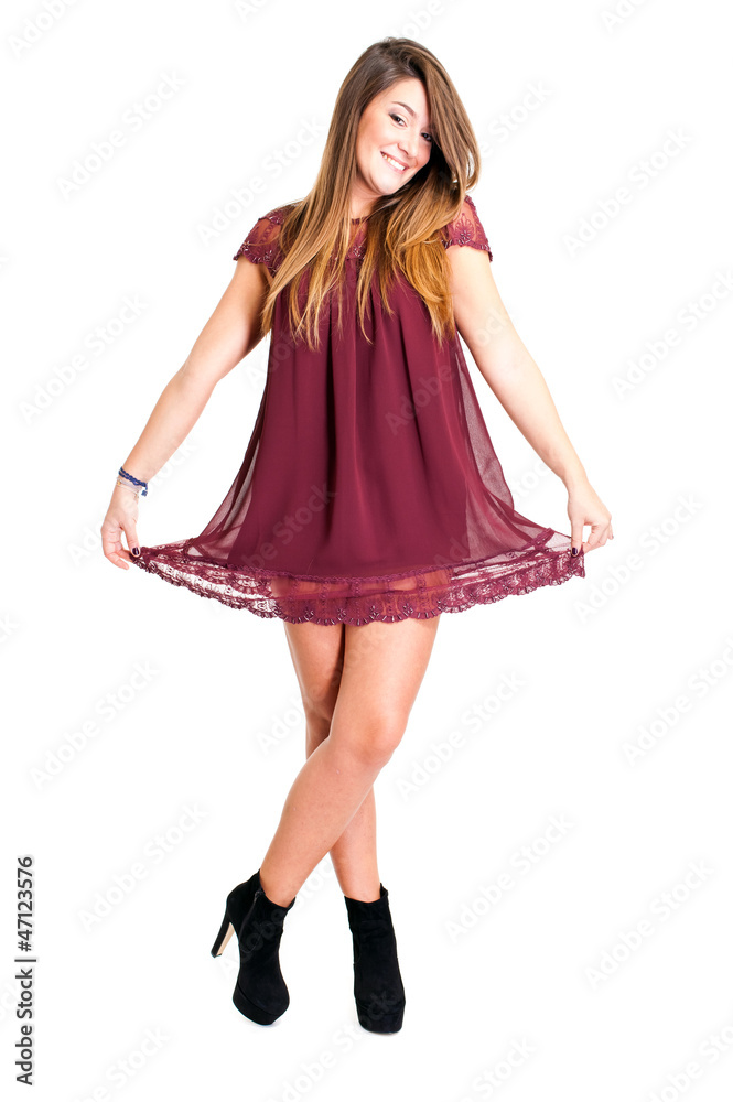 Attractive girl in red dress posing on white background Attractive girl in red dress posing on white background