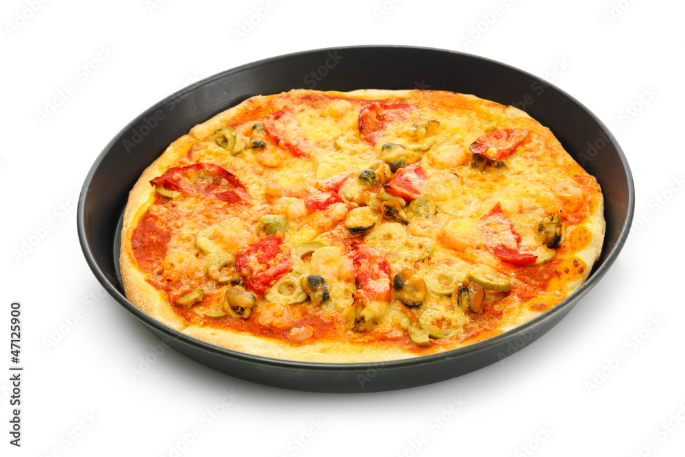 Delicious pizza with seafood in the frying pan isolated on Delicious pizza with seafood in the frying pan isolated on