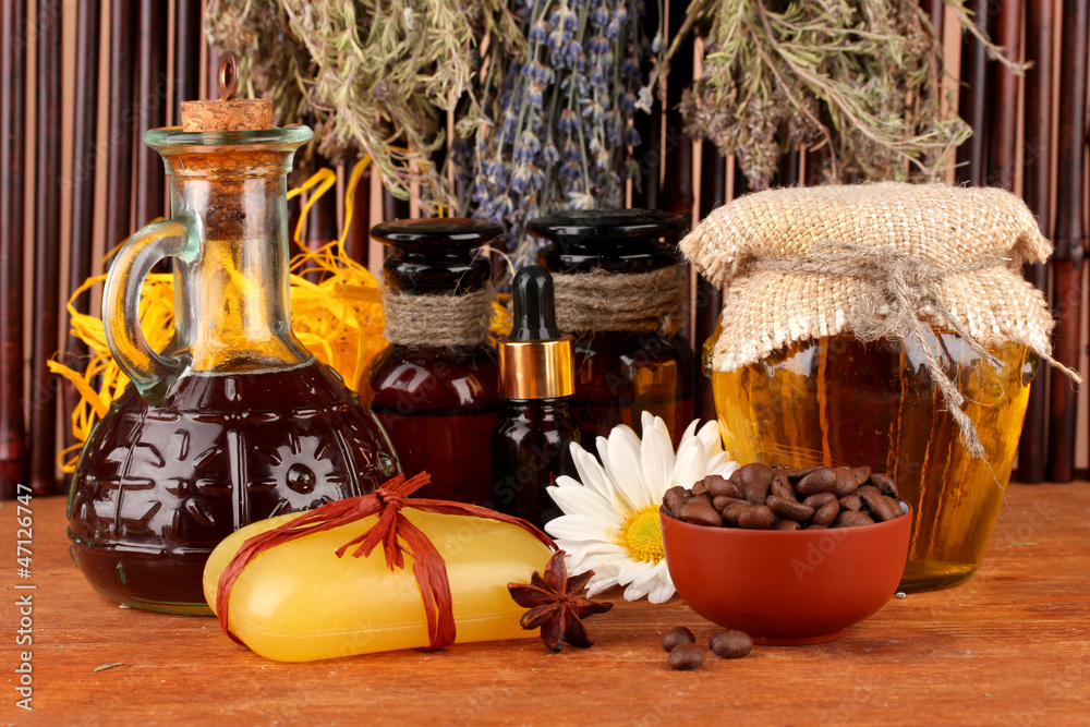 ingredients for soap making on brown background