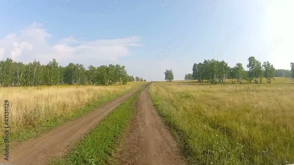 Driving through a vast grass mountainous landscape Driving through a vast grass mountainous landscape
