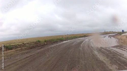 Driving through muddy roads photo