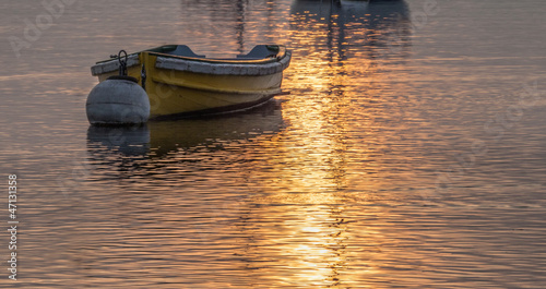 Yellow boat and sunrise