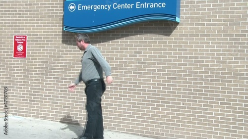 Man Limping to Emergency Room photo