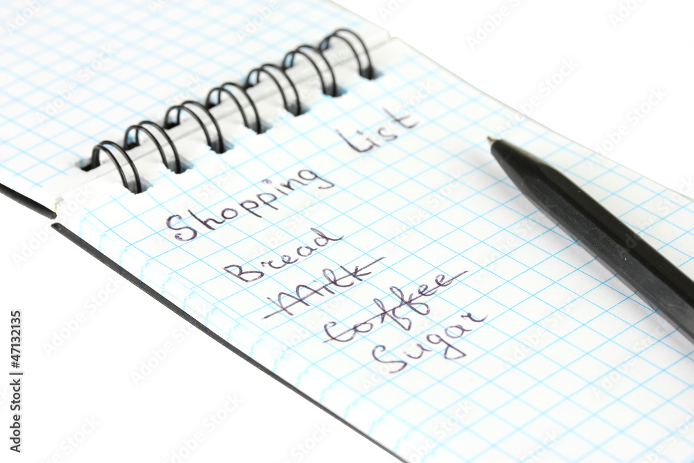 shopping list in a notebook on white background close-up shopping list in a notebook on white background close-up