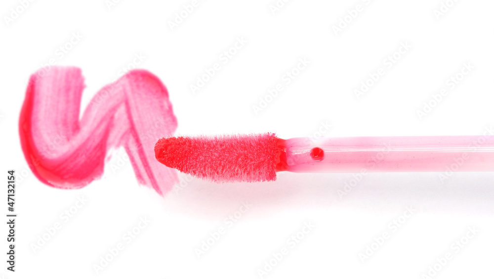 beautiful lip gloss smear with brush, isolated on white beautiful lip gloss smear with brush, isolated on white