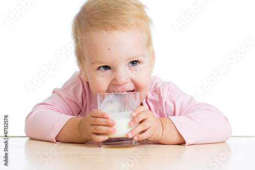 little child drinking yogur...