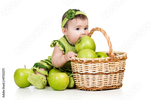 baby eating green apples fr...