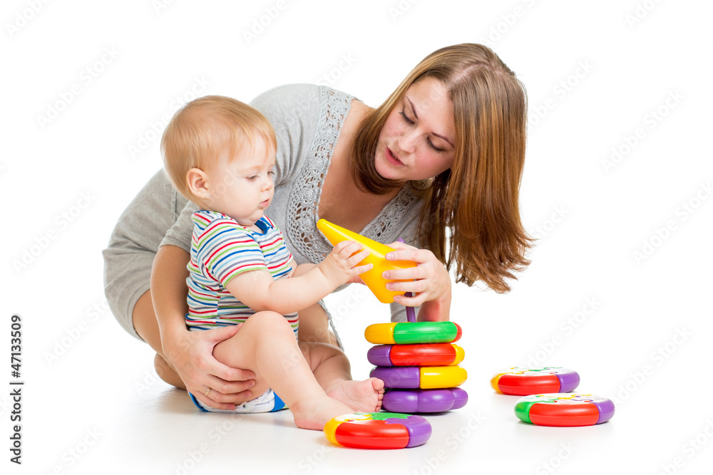 baby boy and mother playing together with construction set toy baby boy and mother playing together with construction set toy