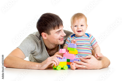 baby boy and father playing...