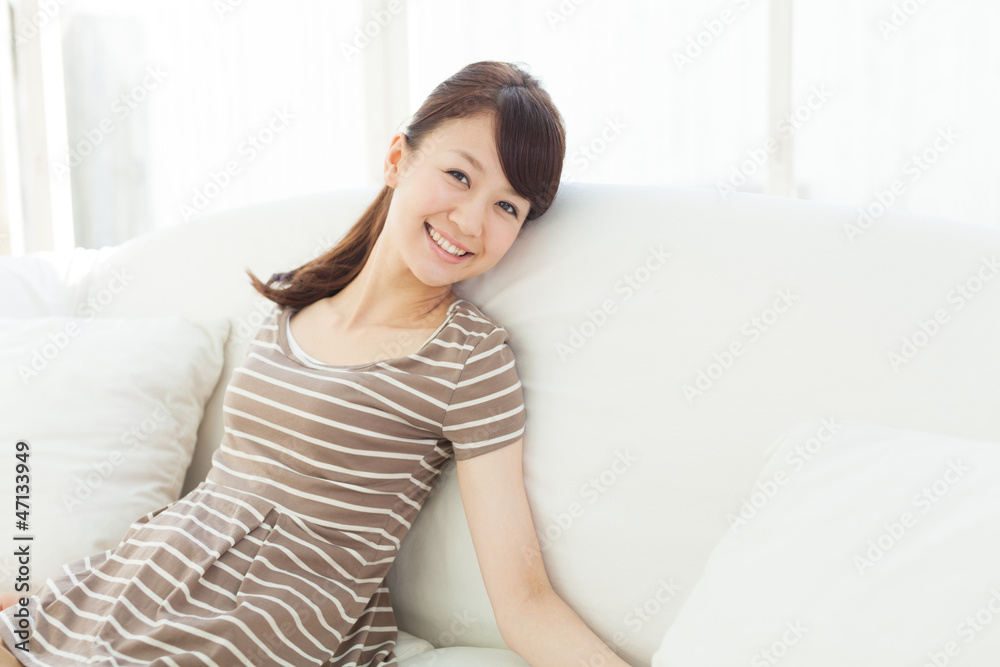 Beautiful young woman relaxing in the room Beautiful young woman relaxing in the room