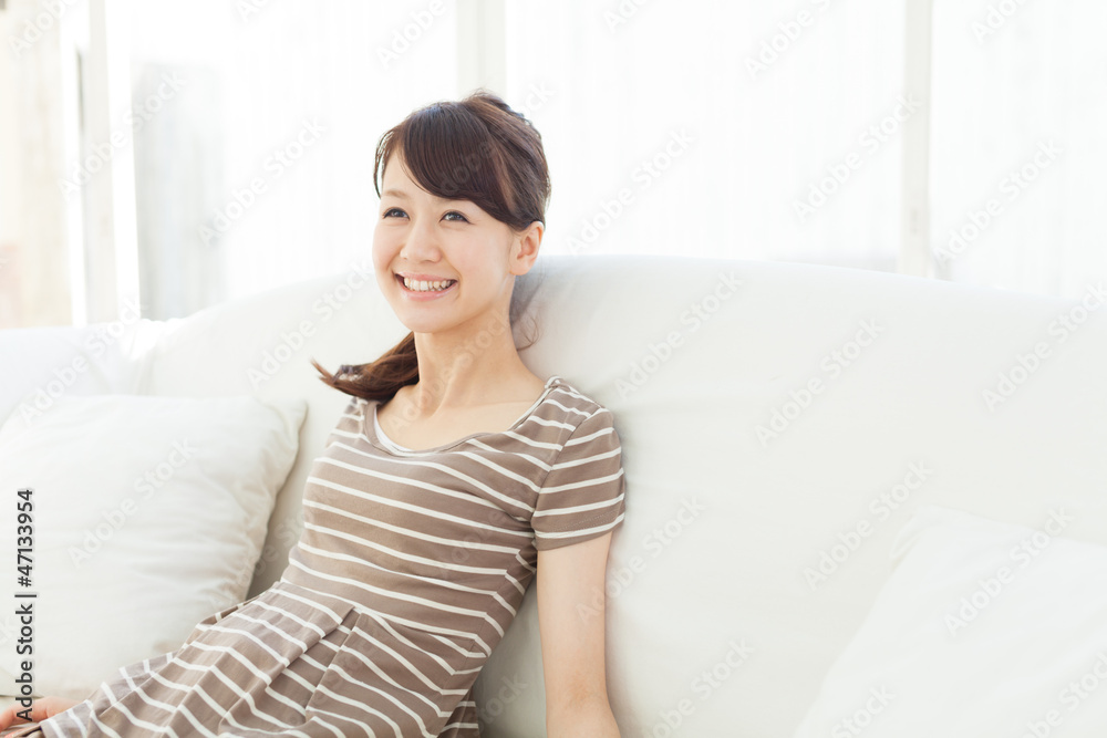 Beautiful young woman relaxing in the room Beautiful young woman relaxing in the room