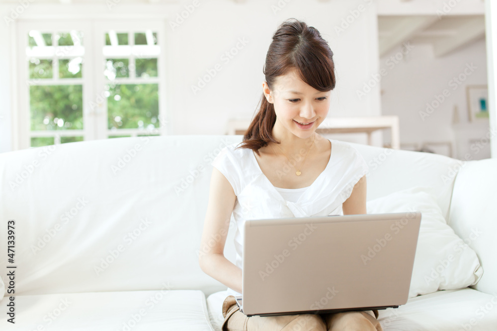 Beautiful young woman using a laptop computer Beautiful young woman using a laptop computer