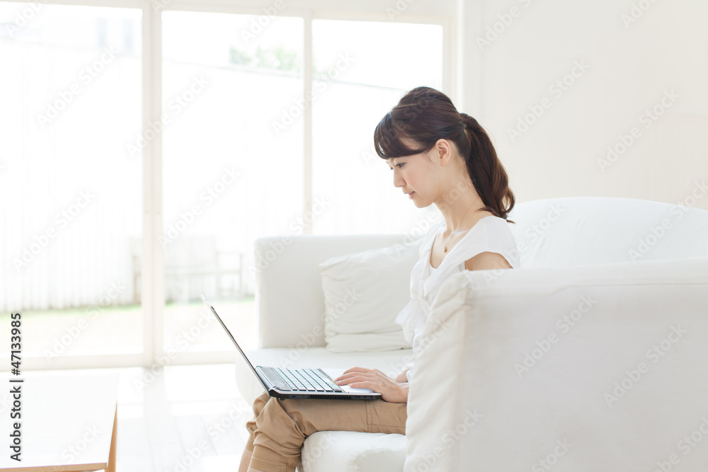 Beautiful young woman using a laptop computer Beautiful young woman using a laptop computer