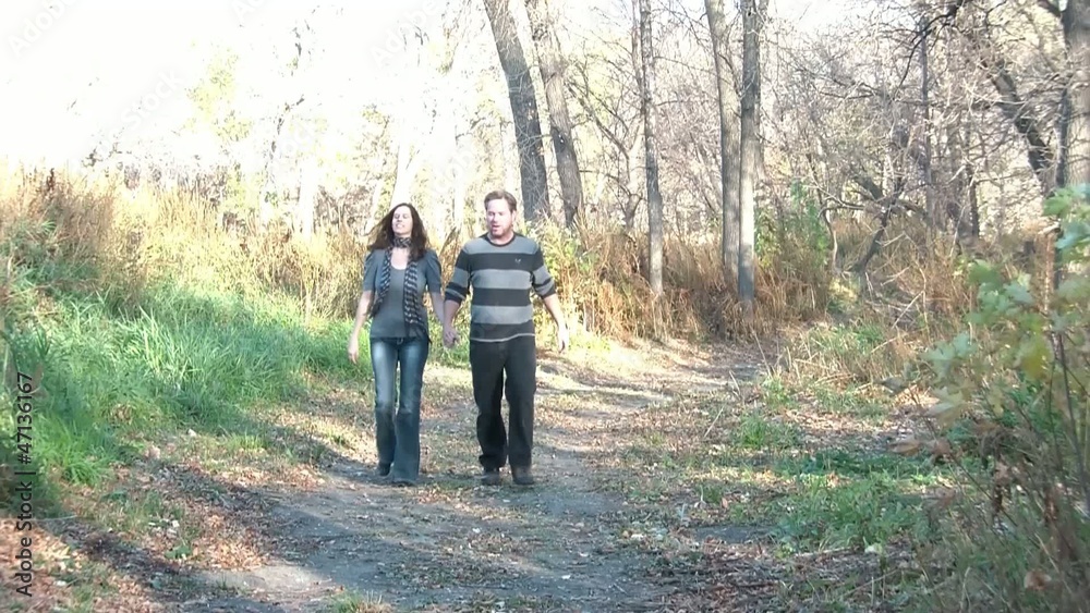 Couple on Date Walks Through Woods Couple on Date Walks Through Woods