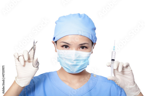 Surgeon woman holding syringe and clippers