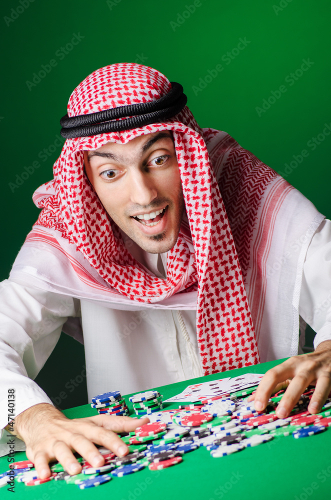 Arab playing in casino - gambling concept with man