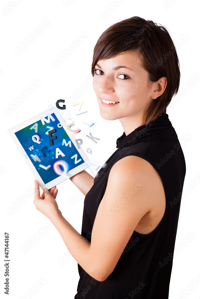 Young woman looking at modern tablet with alphabet Young woman looking at modern tablet with alphabet