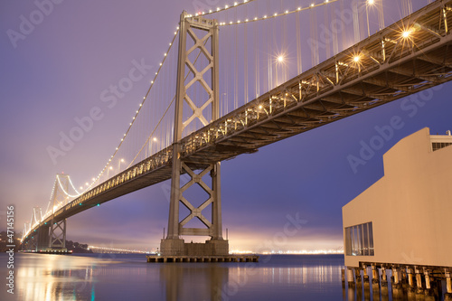 Daybreak with foggy night sky at Bay Bridge , San Francisco