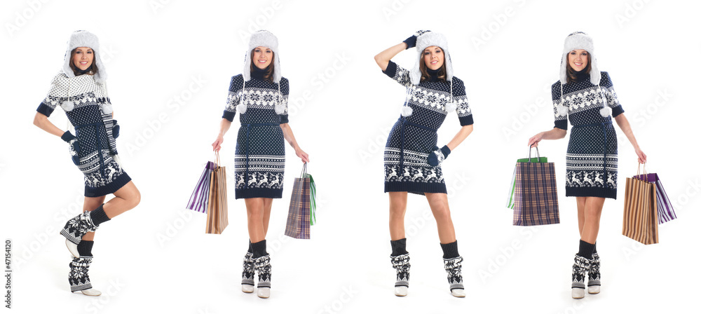 Four young women in warm winter clothes holding bags Four young women in warm winter clothes holding bags