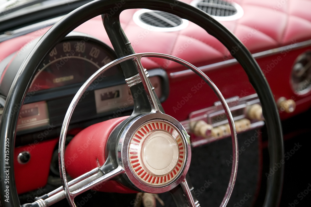 Antique car with red interior inside