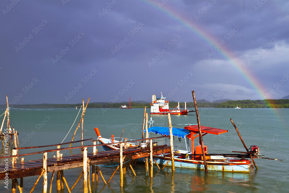 Rainbow and boat on the river at Koh Kho Khao in Thailand