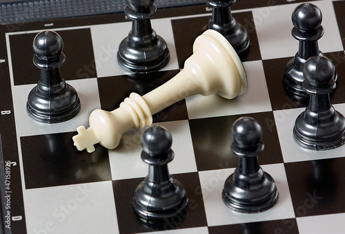 Checkmate (White king is lowered by black pawns)