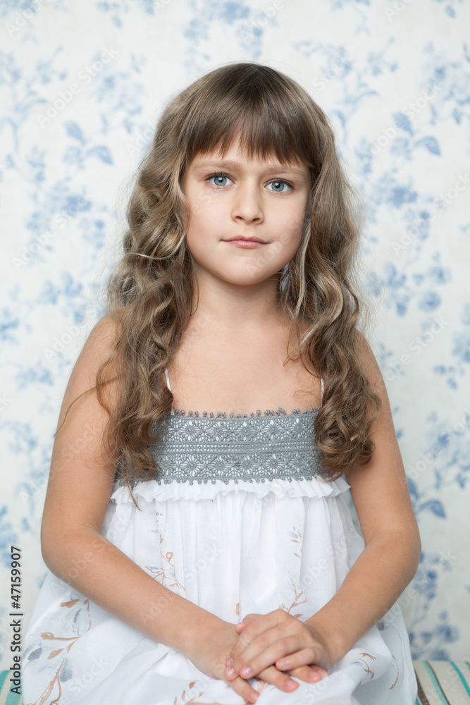 Portrait of sincere young grey-eyed girl child looking at camera Portrait of sincere young grey-eyed girl child looking at camera