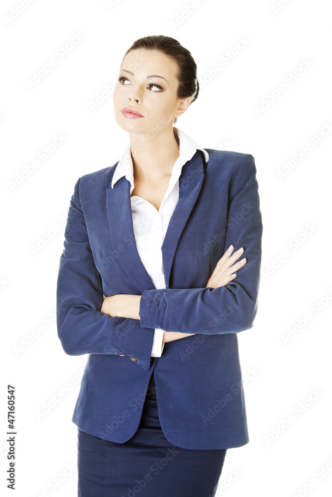 Young thoughtful businesswoman looking on side Young thoughtful businesswoman looking on side