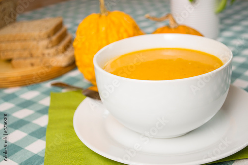 Pumpkin soup in a white plate